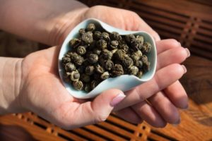 Jasmine green tea pearls in a tea bowl